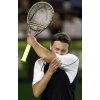 Croatia's Goran Ivanisevic bites his arm after losing a point during his second round match against France's Jerome Golmard, at the Australian Open in Melbourne January 16, 2002. Golmard won 6-3, 7-6, 5-7, 6-4. (Jason Reed/Reuters) 