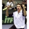 Croatian player Goran Ivanisevic celebrates his victory against German player Rainer Schuettler after the fourth match of the first round Davis Cup match Croatia vs. Germany in the Croatian city of Zagreb, Sunday, Feb. 10, 2002.(AP Photo/Michael Sohn) 