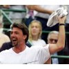 Croatian Goran Ivanisevic waves a towel as he celebrate his teammate Ivan Ljubicic's victory over Argentine Juan Chela in a Davis Cup quarterfinal single tennis game at the Buenos Aires Lawn Tennis Club, April 7, 2002. Organisers of this year's Stella Artois Championships at London's Queen's Club said on April 8 that Ivanisevic and world number one Lleyton Hewitt will head the list of challengers in June. REUTERS/Enrique Marcarian