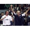 Croatia's Ivan Ljubicic (R) and Goran Ivanisevic (L) celebrate after Ljubicic's over James Blake of the United States in a Davis Cup singles match in Zagreb February 9, 2003. Ljubicic won 6-3 6-7 (5-7) 6-4 6-3 giving Croatia an unbeatable 3-1 lead. REUTERS/Nikola Solic 