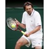 Goran Ivanisevic of Croatia hits a backhand to Mikhail Youzhny during the first round of the 118th Wimbledon  Tennis Championships in Wimbledon(AFP/Carl de Souza) 