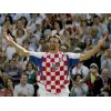  Former Wimbledon champion Croatia's Goran Ivanisevic celebrates as he wears a Croatian national soccer shirt after being defeated by Australia's Lleyton Hewitt in their third round match at the Wimbledon Tennis Championships in London, June 25, 2004. It is expected that the match, which was won by Hewitt 6-2 6-3 6-4, will be Ivanisevic's last at Wimbledon. REUTERS/Ian Hodgson 