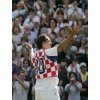  Former Wimbledon champion Croatia's Goran Ivanisevic greets the crowd as he wears a Croatian national soccer shirt after being defeated by Australia's Lleyton Hewittin their third round match at the Wimbledon Tennis Championships in London, June 25, 2004. It is expected that the match, which was won by Hewitt 6-2 6-3 6-4, will be Ivanisevic's last at Wimbledon. REUTERS/Ian Hodgson 