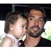  Croatian tennis player Goran Ivanisevic holds his baby daughter Amber Maria upon landing at the Zagreb airport after being defeated in 3rd round of the Wimbledon tennis tournament, Saturday, June 26, 2004. (AP Photo/Robert Rajtic)