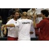 Croatian tennis star Goran Ivanisevic, left, Ivan Ljubicic, center and Mario Ancic jubilate after defeating Dmitry Tursunov and Igor Andreev of Russia in their semifinal Davis Cup doubles match, in Split, Croatia, Saturday, Sept. 24, 