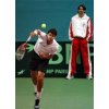 Croatia\'s tennis legend Goran Ivanisevic, background right, looks on as Croatia's Tennis Davis Cup team player Mario Ancic, left, serves a ball during a training session in Bratislava, Slovak Republic, on Thursday, Dec. 1, 2005. Slovakia and Croatia, both first-time finalists, will play their matches from Dec. 2 to 4, 2005. (AP Photo/Darko Bandic)