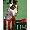 Croatia\'s Davis Cup player and former Wimbledon champion Goran Ivanisevic, foreground, and team captain Nikola Pilic look on after Slovakia\'s Davis Cup player Dominik Hrbaty won 7-6, 6-3, 6-7, 6-4 against Croatia's Mario Ancic during their Davis Cup finals in Bratislava, Slovakia, Friday, Dec. 2, 2005. (AP Photo/Anja Niedringhaus)