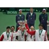 Team Croatia\'s captain Nikola Pilic (C) lifts up the Davis Cup trophy with Mario Ancic, Goran Ivanisevic, Ivan Ljubicic and Ivo Karlovic (L-R) at the end of the award ceremony in the Slovak capital of Bratislava December 4, 2005. Croatia won the Davis Cup for the first time on Sunday when Ancic defeated Slovakia\'s Michal Mertinak 7-6 6-3 6-4 to give them the 3-2 victory. At the back are Slovakia's Davis Cup team members Dominik Hrbaty, captain Miloslav Mecir and Karol Beck (L-R). REUTERS/Petr Josek 