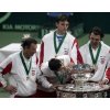 Croatia\'s Davis Cup team member Mario Ancic kisses the trophy as Goran Ivanisevic, right, Ivo Karlovic, top and the team\'s captain Nikki Pilic, left, celebrate after defeating Slovakia in their Davis Cup final match in Bratislava, Slovakia, Sunday, Dec. 4, 2005. (AP Photo/Darko Bandic)
